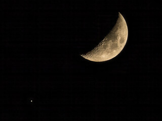Moon and Venus side by side in night sky © Gabdulvachit