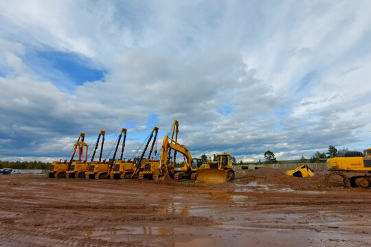 Pipelayers, an excavator and a bulldozer stand in the parking lot of special equipment. Construction of a gas pipeline