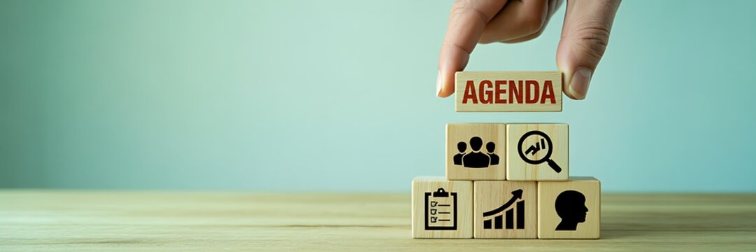 Business agenda planning concept with wooden blocks on desk background