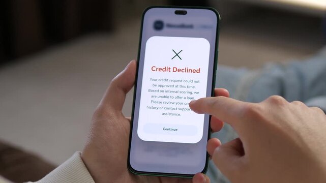 Modern fintech app interface showing a loan rejection notification on a smartphone. Detailed UI design for digital banking and credit scoring. Ideal for tech reviews, banking services, and mobile