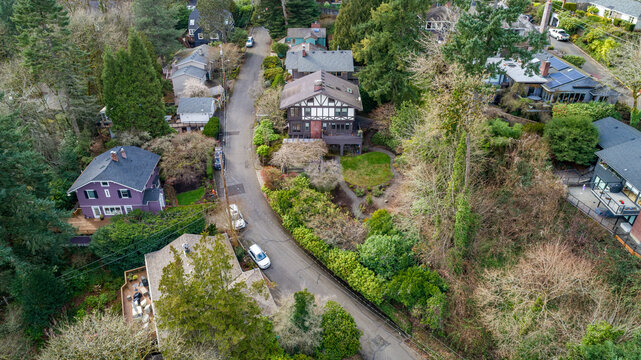 Aerial view of the Northwest Imperial Terrace neighborhood featuring residential houses nestled among lush green trees and winding streets Portland, Oregon, United States.