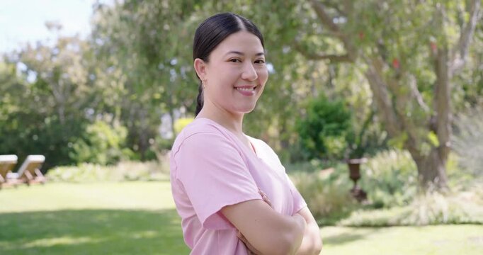 Asian woman on garden lawn shifting from closed pose to smiling reacting to camera moving closer