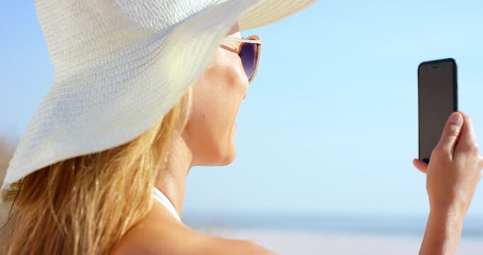 Travel, video call or woman at beach with wave, tourist vacation or online chat on weekend break. Happy, hello or person at sea with connection, digital communication or summer holiday in Australia.