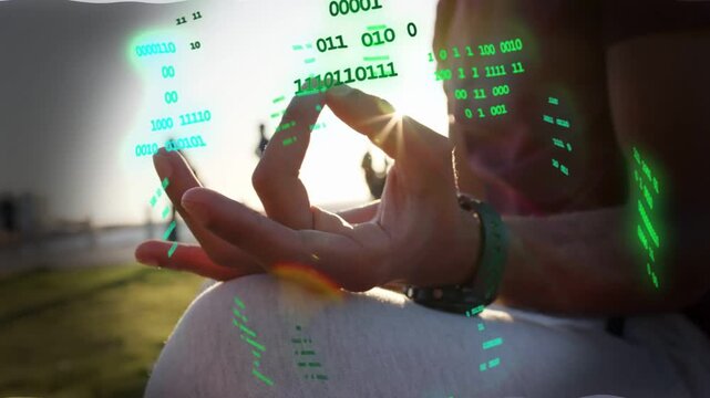 Seated man meditating with mudra over knee, sun aligning and green tech data overlay circling hand