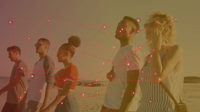 Five adults walking beach, starting red nodes overlay anchoring people, showing tech connection