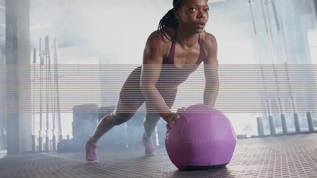 Fitness pro doing core pushups from plank on purple ball, motion lines showing core for stability