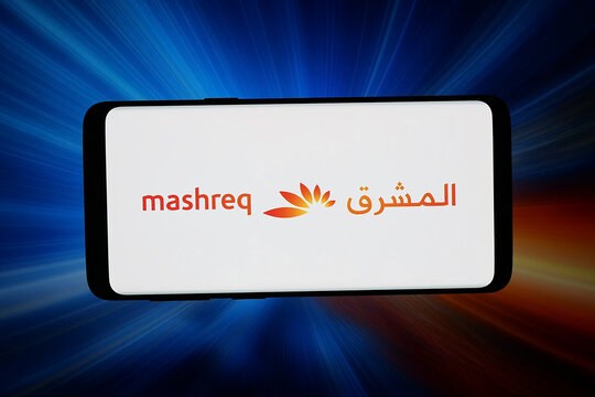 Stuttgart, Germany - 04-27-2026: In this photo illustration, the logo of company Mashreqbank PSC (Mashreq Bank) is displayed on a smartphone in front of abstract background on computer screen.