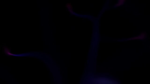 Abstract scientific demonstration of ionized gas with vibrant purple and blue plasma filaments dancing and flickering against a solid dark background in a laboratory environment.