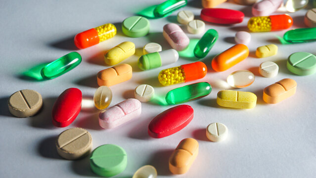 A strong light shining on pils and capsules so causing a strong shadow.