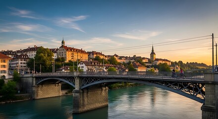 Obraz premium Historic European City Bridge Spanning Calm River at Sunset