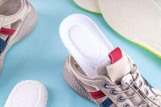 Comfortable Running Insoles, healthy sport shoe insoles with foot support, revention of flat feet and orthopedic diseases of the foot. Foot care, foot comfort