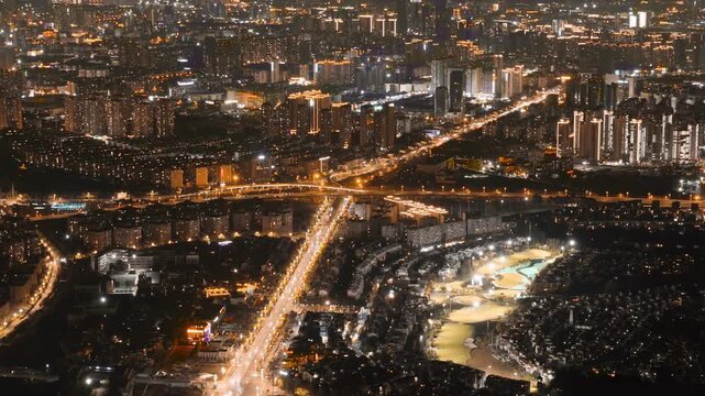 Aerial Night Cityscape with Illuminated High Rises and Roads