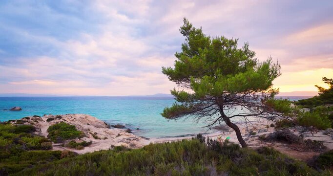 Paradise hidden wild beach Kavourotripes with rocks and turquoise clear sea water, Chalkidiki, Greece panorama