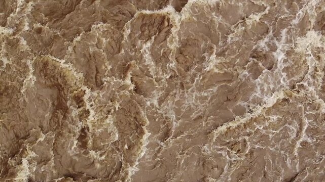 Aerial shot of Rio Quijos, Ecuador in flood, A tributary of the Amazon on the eastern slope of the Andes in Ecuador in flood after a tropical storm