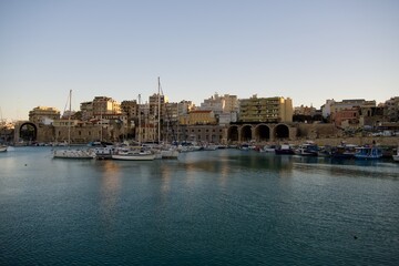 Fototapeta premium Boats anchored at the Venetian harbor and Koules Fortress in Heraklion, Crete, Greece.