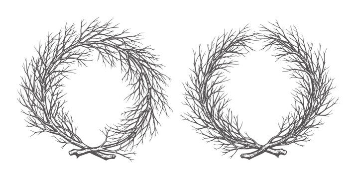 Two dark grey bare branch wreaths tied with twine white branches