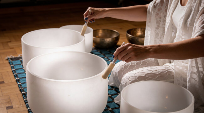 Stress Relief Sound Bath Meditation with Woman Playing White Quartz Crystal Singing Bowls