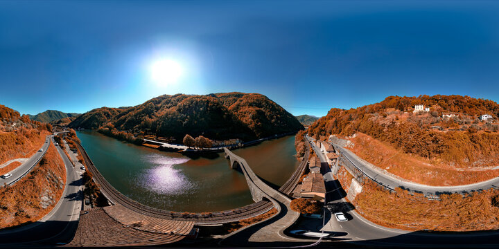 360 aerial view of Ponte della Maddalena in Borgo a Mozzano with autumn colors