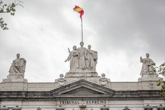 Detail of the statues at the top of the main facade of the Spanish Supreme Court