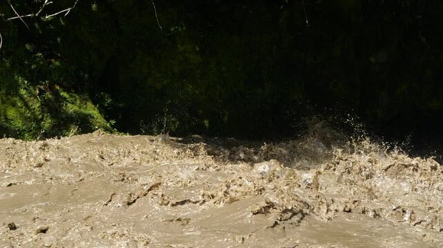 Rio Quijos, Ecuador in flood, A tributary of the Amazon on the eastern slope of the Andes in Ecuador in flood after a tropical storm, slow motion
