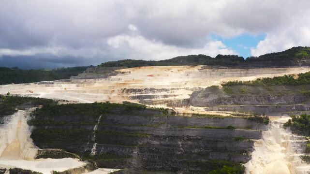 Aerial drone of Limestone quarry for the construction industry in the mountains. Bohol, Philippines.