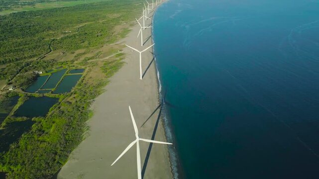 Electrical wind power. Wind farm turbine in motion. Generating clean power from wind.