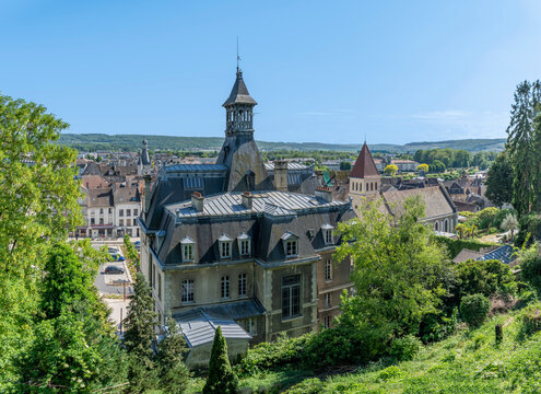 Chateau-Thierry, France - 05 01 2026: Panoramic view of the town hall, the United Protestant Church, the Balhan Tower and the surrounding countryside with sunny blue sky
