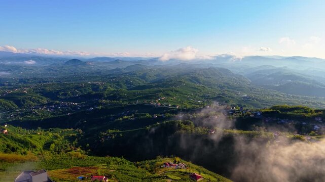 Aerial 4K drone shot of foggy green valleys and mountains at sunrise, Black Sea region Turkey