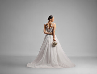 Fototapeta premium Rear view shot of an elegant bride