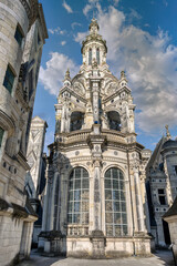 Obraz premium The Chateau de Chambord, in the Centre-Val de Loire region, is one of the most recognizable châteaus in the world due to its French Renaissance architecture.