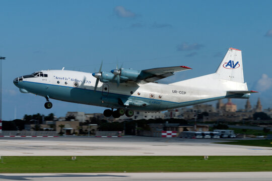 Luqa, Malta - December 24, 2005: Aerovis Airlines Antonov An-12AP (REG: UR-CCP), the "Russian Hercules", takes off from runway 32. 