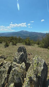 Rocky terrain stretches under clear blue skies. Ljukten peak, (Balkans, Serbia) Vertical