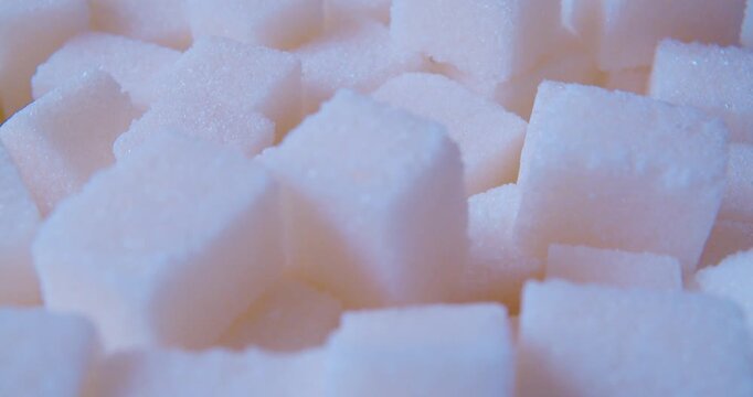 A macro shot of a pile of sugar cubes.Food background. The soft natural light.