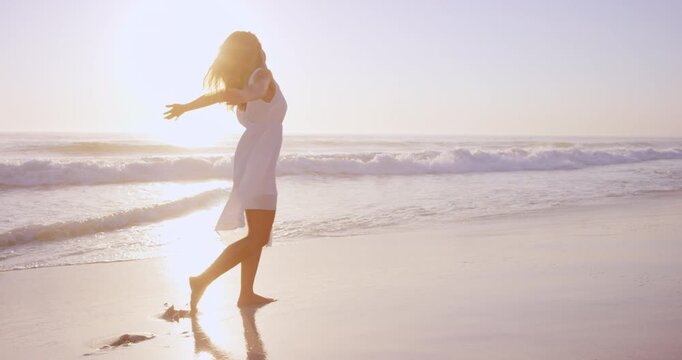 Freedom, spin and woman at beach for holiday, summer break and weekend travel for tropical getaway. Walking, tourism and person with coastal view for vacation peace, sunshine and wellness in Bali