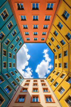 Colorful Geometric Apartment Courtyard with Symmetrical Architecture and Blue Sky