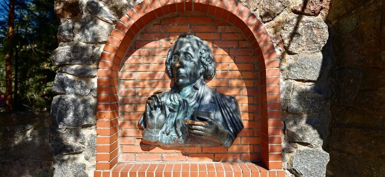 Sosnoviy Bor, Russia - May 05, 2026: Hans Christian Andersen monument in Andersengrad, detailed bronze bust set against a brick wall with natural light illuminating the scene