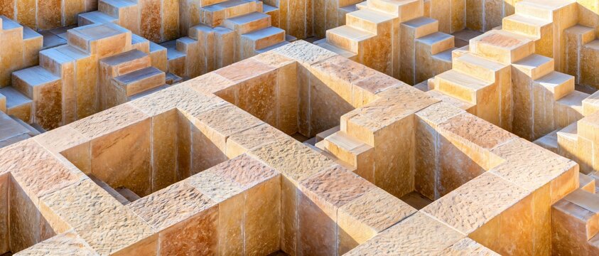 Geometric stone blocks form a repeating pattern