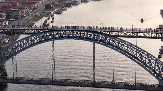 Walking Dom Luis I Bridge Porto overlooking Douro River