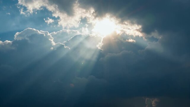 Dramatic Sun Rays Breaking Through Dark Stormy Clouds Creating Cinematic Atmosphere for Powerful Backdrop