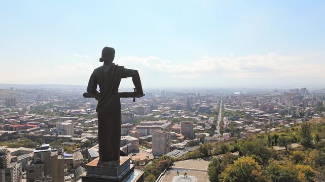 Yerevan, Armenia - 19th october, 2024: Aerial view Mother Armenia statue. Female personification of Armenia. Famous high monumental statue in Victory Park overlooking the capital city of Yerevan
