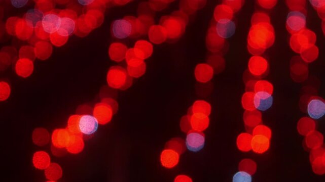 Abstract red light bokeh background with glitter