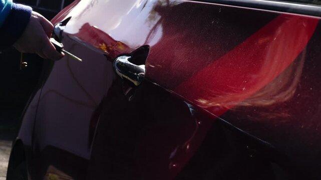Driver unlocking and opening car door