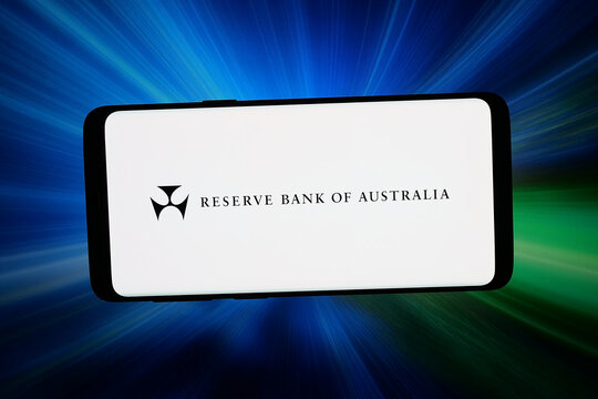 Stuttgart, Germany - 04-27-2026: In this photo illustration, the logo of institution Reserve Bank of Australia (RBA) is displayed on a smartphone in front of abstract background on computer screen.