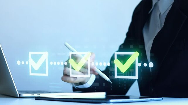 Using a digital tablet to check off tasks during work in an office setting on a clear day.