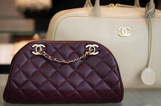 The window display of a luxury shop featuring Chanel handbags in various sizes and colours. Milan, Italy, 15 April 2026