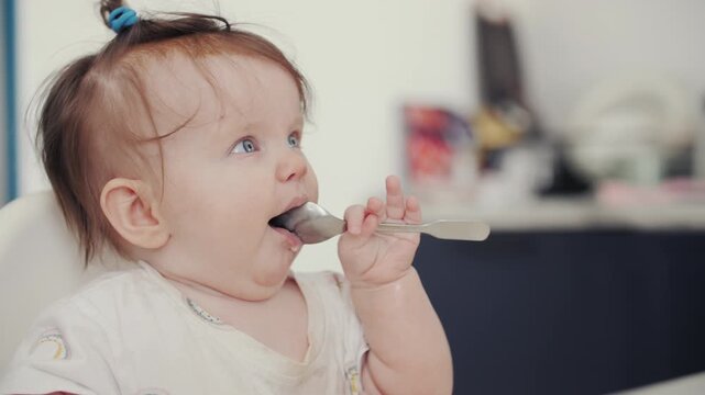 Cute Baby First Feeding at Home Child Trying Solid Food