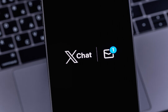 XChat logo mobile app on a screen closeup smartphone iPhone. X Chat is a new messenger from Elon Musk, integrated into the X (Twitter). Batumi, Georgia - March 16, 2026