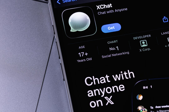 XChat icon mobile app on a screen smartphone iPhone closeup. X Chat is a new messenger from Elon Musk, integrated into the X. Batumi, Georgia - March 16, 2026