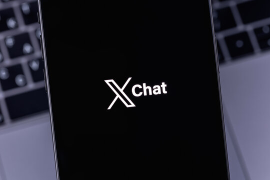 XChat logo mobile app on a screen smartphone iPhone closeup. X Chat is a new messenger from Elon Musk, integrated into the X (Twitter). Batumi, Georgia - March 16, 2026