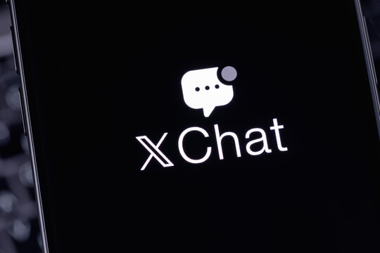XChat logo mobile app on a screen smartphone iPhone closeup. X Chat is a new messenger from Elon Musk, integrated into the X. Batumi, Georgia - March 16, 2026